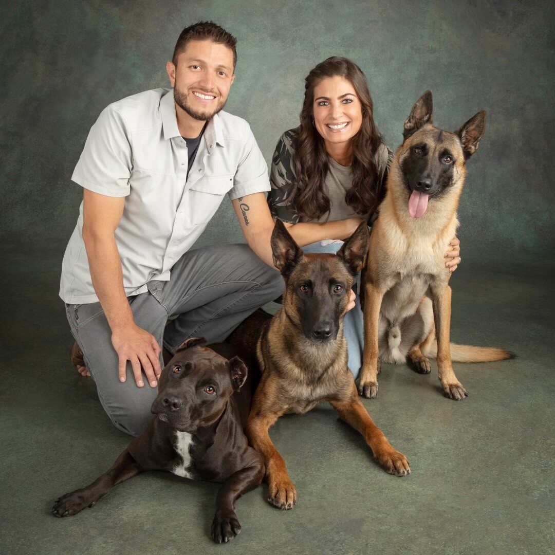 Carlos and Elizabeth of Wolf's Lair K9 with their dogs